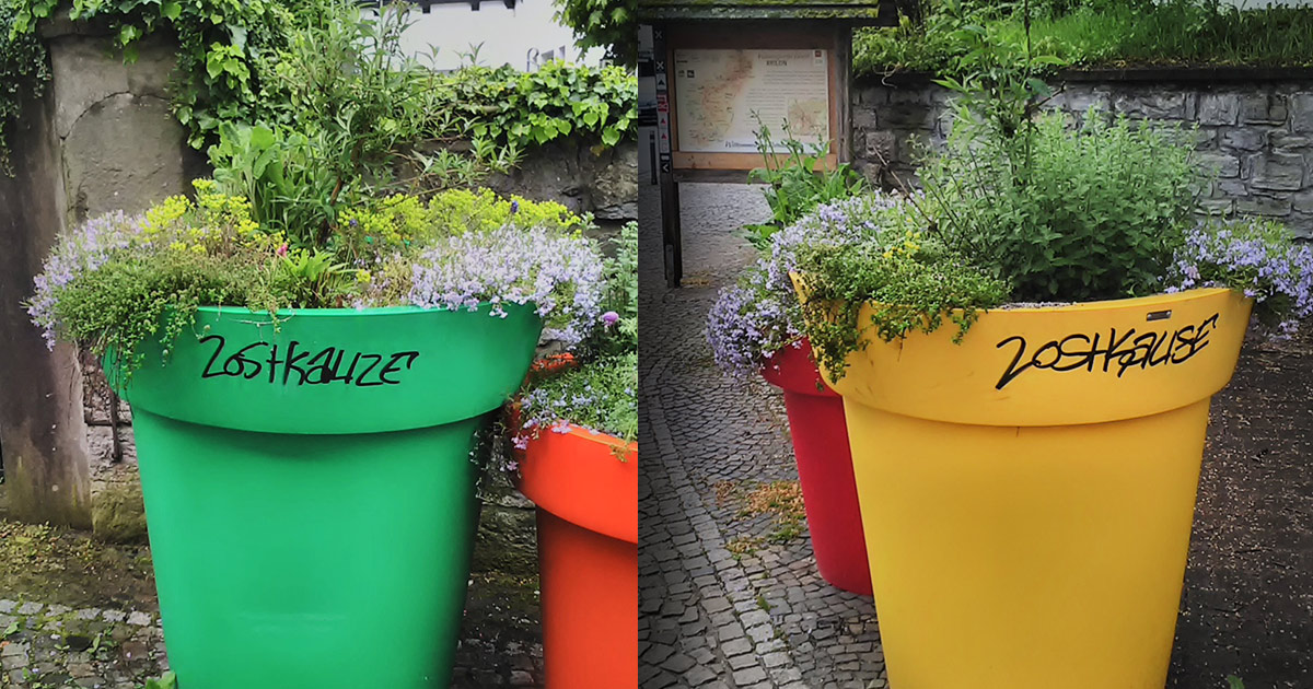 Schmierereien an Blumenkuebeln und Abfalleimern in Brilon